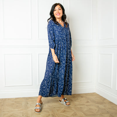 The navy blue Asymmetric 3/4 Sleeve Tea Dress in a fun spotty polka dot print with pockets on either side of the torso